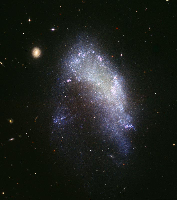 Image of Extremely elongated, football-like shaped elliptical galaxy. 